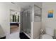 Bathroom features a modern glass-enclosed shower, toilet, and is connected to the main bedroom at 6225 Scarlet Darter Way, Tampa, FL 33625