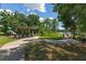 Scenic community area showcasing a covered picnic area, playground, and a dock by the lake at 6225 Scarlet Darter Way, Tampa, FL 33625