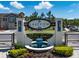 Community entrance sign, Lakeview at Citrus Park, featuring manicured landscaping and a water feature at 6225 Scarlet Darter Way, Tampa, FL 33625
