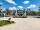 Gated community entrance with decorative landscaping and signage for Lakeview at Citrus Park at 6225 Scarlet Darter Way, Tampa, FL 33625