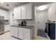 View of kitchen area with modern appliances, granite countertops, and barstool seating at 6225 Scarlet Darter Way, Tampa, FL 33625