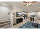 Open concept living room adjacent to kitchen and stairs at 6225 Scarlet Darter Way, Tampa, FL 33625