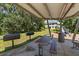 Community picnic area featuring grills, picnic tables, a playground, and green space for recreation at 6225 Scarlet Darter Way, Tampa, FL 33625
