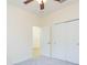 This bedroom features carpet flooring, closet and ceiling fan at 711 Parker Den Dr, Ruskin, FL 33570