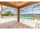 Enjoy the lake view from the covered, screened lanai and the pristine pool, perfect for entertaining at 711 Parker Den Dr, Ruskin, FL 33570