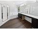Bright bathroom featuring a shower, bathtub, and dark wood vanity with a white countertop at 8114 Pond Shadow Ln, Tampa, FL 33635