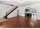 Spacious living room featuring wood flooring, natural light, and an open layout for versatile furniture arrangements at 8114 Pond Shadow Ln, Tampa, FL 33635