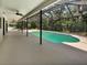 Large screened-in pool and patio area offering privacy and outdoor enjoyment at 8114 Pond Shadow Ln, Tampa, FL 33635