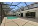 Spacious screened-in pool area, perfect for outdoor entertaining and relaxation at 8114 Pond Shadow Ln, Tampa, FL 33635