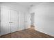 Bright bedroom with wood-look floors, and double door closet at 936 57Th N Ave, St Petersburg, FL 33703