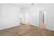 Open bedroom features wood-look flooring and multiple doorways to other rooms at 936 57Th N Ave, St Petersburg, FL 33703