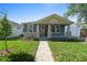 Charming home with inviting curb appeal, lush lawn, and stone accents at 936 57Th N Ave, St Petersburg, FL 33703