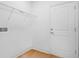 Clean, white laundry room with wire shelving and light wood-look floors at 936 57Th N Ave, St Petersburg, FL 33703