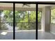 Spacious balcony with serene views of lush greenery and a peaceful lake at 9630 Tree Tops Lake Rd, Tampa, FL 33626