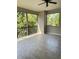 Screened balcony offering peaceful views of surrounding greenery and ample natural light at 9630 Tree Tops Lake Rd, Tampa, FL 33626
