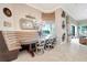 Dining room features banquette seating, chandelier, and view of the pool at 9630 Tree Tops Lake Rd, Tampa, FL 33626