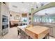 Spacious kitchen features a large butcher block island, stainless steel appliances and a cozy breakfast nook at 9630 Tree Tops Lake Rd, Tampa, FL 33626