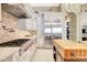 This well-equipped kitchen features white cabinets, granite countertops, and stainless steel appliances at 9630 Tree Tops Lake Rd, Tampa, FL 33626