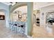 Open concept kitchen with a large island, stainless steel appliances, and seamless access to dining at 9630 Tree Tops Lake Rd, Tampa, FL 33626