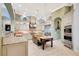 Bright kitchen boasts a center island, stainless steel appliances, pendant lighting, and cream-colored cabinetry at 9630 Tree Tops Lake Rd, Tampa, FL 33626
