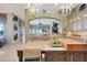 Well-equipped kitchen with granite countertops, a large island, stainless steel appliances, and custom cabinets at 9630 Tree Tops Lake Rd, Tampa, FL 33626