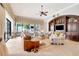 Spacious living room featuring custom built-ins, stylish furnishings, and bright, natural light at 9630 Tree Tops Lake Rd, Tampa, FL 33626