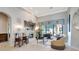 Bright living room features a fireplace, comfortable seating, and large windows, creating a warm and inviting space at 9630 Tree Tops Lake Rd, Tampa, FL 33626
