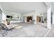 Spacious outdoor living area with brick pavers, outdoor kitchen, and seamless access to indoor living at 9630 Tree Tops Lake Rd, Tampa, FL 33626
