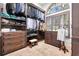 Well-organized walk-in closet with custom shelving, drawers, and ample storage space at 9630 Tree Tops Lake Rd, Tampa, FL 33626