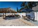 Inviting backyard patio with a shaded gazebo, outdoor dining set, and plenty of space for relaxation and entertainment at 12901 129Th Ave, Largo, FL 33774