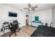 Bedroom featuring wood-look flooring, ceiling fan, and plenty of room for a desk and bed at 12901 129Th Ave, Largo, FL 33774