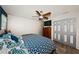 Spacious bedroom with a ceiling fan, wood-look flooring, and neutral-colored walls at 12901 129Th Ave, Largo, FL 33774