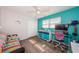 Colorful bedroom with unique decor, bright accents, and wood-look flooring at 12901 129Th Ave, Largo, FL 33774