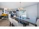 Open dining space with kitchen, features table with seating, and natural light from backyard view at 12901 129Th Ave, Largo, FL 33774