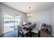 Bright dining room featuring wood floors, backyard access, and natural lighting at 12901 129Th Ave, Largo, FL 33774