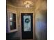 Charming front entry with a decorative glass door, house number, and adjacent window allowing natural light at 12901 129Th Ave, Largo, FL 33774