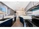 Kitchen featuring stainless appliances, tile backsplash, and breakfast bar at 12901 129Th Ave, Largo, FL 33774