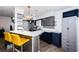 Lovely kitchen featuring stainless appliances, modern cabinets, white countertops and wood flooring at 12901 129Th Ave, Largo, FL 33774