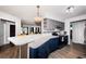 Open-concept kitchen with quartz countertops, modern appliances, and breakfast bar seating area at 12901 129Th Ave, Largo, FL 33774