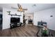 Open living room boasts hard surface floors and modern ceiling fan at 12901 129Th Ave, Largo, FL 33774