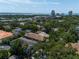 Expansive aerial view of neighborhood with lush greenery, glimpses of Tampa Bay and downtown skyline at 1008 S Armenia Ave # A, Tampa, FL 33629