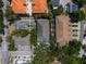 An aerial view of the property nestled amongst trees, streets, and other homes at 1008 S Armenia Ave # A, Tampa, FL 33629