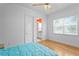 Bright and airy bedroom features ample natural light, neutral color scheme and access to an ensuite bathroom at 1008 S Armenia Ave # A, Tampa, FL 33629