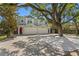 Charming two-story home with a paved driveway, two-car garage, and ample parking at 1008 S Armenia Ave # A, Tampa, FL 33629