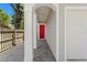 Inviting entrance of home with red front door, brick walkway, and white pillars, leading to the home at 1008 S Armenia Ave # A, Tampa, FL 33629