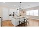 Bright kitchen featuring white cabinets, stainless steel appliances, granite countertops and hardwood floors at 1008 S Armenia Ave # A, Tampa, FL 33629