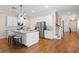 Bright kitchen featuring white cabinets, stainless steel appliances, granite countertops and hardwood floors at 1008 S Armenia Ave # A, Tampa, FL 33629