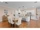 Open concept kitchen and dining area featuring stainless steel appliances, granite countertops and hardwood floors at 1008 S Armenia Ave # A, Tampa, FL 33629