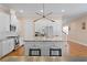 Well-appointed kitchen featuring stainless steel appliances, center island with seating and hardwood floors at 1008 S Armenia Ave # A, Tampa, FL 33629