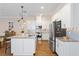 Bright kitchen featuring white cabinets, stainless steel appliances, granite countertops and hardwood floors at 1008 S Armenia Ave # A, Tampa, FL 33629